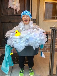 a child dressed as a bathtub full of bubbles