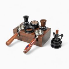 an assortment of kitchen utensils are shown on a wooden stand with matching knobs