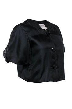 Are you a boss lady bored with the basic blazers in your closet? Try this adorable jacket on for size! Made in a trendy cropped silhouette with precious puff sleeves, this silk beauty is perfect for giving your professional wardrobe a modern upgrade. Layer over a crisp button-up and sleek slacks and you’re bound to be best dressed at the budget meeting! Size 6 100% Silk Made in Italy Front button-up closure Lined Cropped silhouette Round neckline Short puff sleeves Shoulder to shoulder 16” Bust Sweater Trends, Professional Wardrobe, Cute Jackets, Buy Shoes Online, Armani Collezioni, Silk Jacket, Italian Fashion Designers, Black Crop, Boss Lady