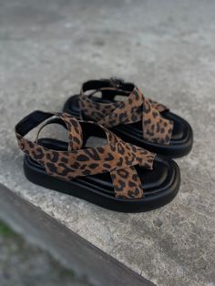 Handcrafted from leopard print suede leather upper and leather lining, the Emma Sandals are your go-to footwear for summer looks. A soft square toe design along with a thong design and buckle strap closure, these sandals come with a soft memory foam insole for your day long comfort. You will love and enjoy your Emma sandals for sure. PRODUCT INFORMATION * High quality leopard print suede leather upper (available in other colors on request) * Leather lining * Thong design * Adjustable ankle strap Flat Heel Leopard Print Sandals For Summer, Leopard Print Flat Heel Sandals For Summer, Summer Sandals With Leopard Print And Flat Heel, Summer Leopard Print Sandals With Round Toe, Leopard Print Open Toe Sandals For Vacation, Summer Leopard Print Platform Sandals, Leopard Print Round Toe Sandals For Vacation, Leopard Print Platform Sandals With Round Toe, Leopard Print Open Heel Sandals For Summer