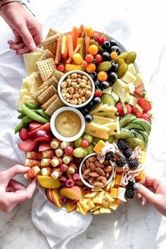 a bunch of food is arranged in the shape of a circle on top of a table