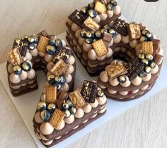 there is a cake made to look like the number 50 with chocolates and waffles on it