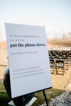 a sign in front of rows of chairs that say we love our photographer, you will to put the phone down