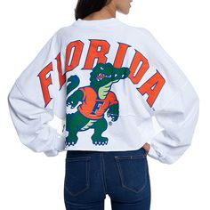 Whether you're a current student, alumni or just a superfan, every member of the Florida Gators franchise needs a solid collection of gear. This season, spruce up your look with this chic Raw Hem Cropped Spirit Jersey T-shirt! The fierce Florida Gators graphics and super-soft blend make this fun top a must-have addition to your closet!Whether you're a current student, alumni or just a superfan, every member of the Florida Gators franchise needs a solid collection of gear. This season, spruce up School Spirit Shirts Designs, School Shirt Designs, School Spirit Shirts, Cheer Shirts, College T Shirts, Jersey Long Sleeve, Spirit Shirts, Spirit Jersey, Spirit Wear