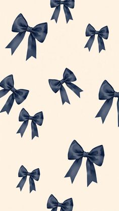 several blue bows are flying in the air