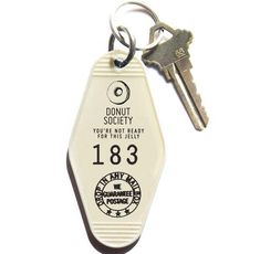 a keychain with the words donut society printed on it