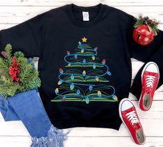 If you're a book lover, this is the shirt for you! This christmas gift features a festive tree with books sticking out of it. The shirt is made from soft and comfortable fabric, perfect for wearing all day long. It's also a great way to show your support for the library community during the holiday season. So whether you're looking for a unique Christmas gift or just want to add some extra warmth to your wardrobe, consider purchasing this shirt today. * S I Z I N G * ✺ Sizing is unisex  ✺ For adults, size runs like men's, though not overly large. Most women find their typical size works best, since they are meant to fit a touch loose and go up 1 or 2 sizes if you want the oversized look. ✺ Size guide and fit:  The size chart is listed in photos above.  Please use the measurement for the mo Little Sister Gifts, Book Tree, Teacher Librarian, Book Shirt, Tree Sweater, Unique Christmas Gift, Christmas Book, Make Her Smile, Sweater Christmas