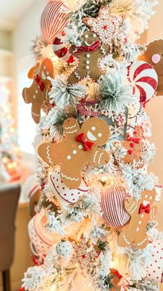 a christmas tree decorated with gingerbreads and candy canes