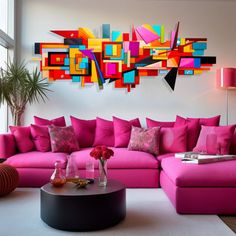 a living room filled with pink couches and pillows