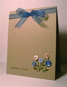 a card with buttons attached to it and a blue ribbon around the top that says thanks so much