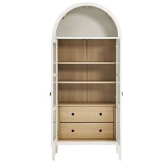 a white bookcase with two drawers and an arched doorway on the top shelf, in front of a white background