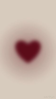 a blurry image of a red heart on a white background