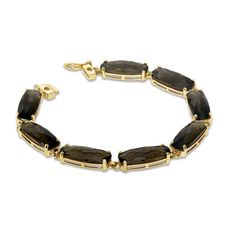 Raise the style bar with this sleek and stunning fashion bracelet! Crafted in 10K gold, each link is set with an elegant 18.0 x 7.0mm bar-shaped cushion-cut smoky quartz. Eight shimmering quartz are used to create this captivating style. Polished to a brilliant luster, this 7.0-inch bracelet secures with a tongue and groove clasp. Classic Smoky Quartz Jewelry For Formal Occasions, Elegant Gold Jewelry With Smoky Quartz, Elegant Smoky Quartz Jewelry For Formal Occasions, Elegant Yellow Gold Smoky Quartz Jewelry, Elegant Faceted Smoky Quartz Jewelry, Halo Engagement Ring Wedding Band, Engagement Rings Vintage Halo, Gold Cushions, Gold Diamond Wedding Band