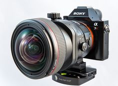 a sony camera attached to a tripod with the lens on it's side