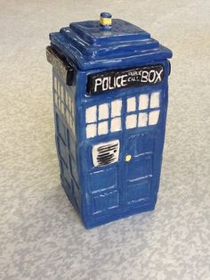 a blue police box sitting on top of a table