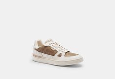 Signature coated canvas and leather upper Fabric lining and footbed EVA and rubber outsole Lace-up closure Style No. CY239 Coach Outlet, Signature Canvas, Shoe Clips, Low Top, Top Sneakers, Womens Sneakers, Outlet, Leather Upper, Lace Up