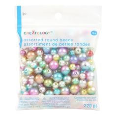 a bag of assorted round beads in pastel colors