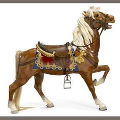 a toy horse is shown on a white background