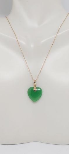 Heart Green Jade 14k Solid Yellow Gold Charm / Pendant / Necklace 18 Inches 14k ROPE Yellow Gold Chain. JADE HEART LOVER. Green Jade is the most admired gemstone by the Chinese. They consider it a symbol of the five virtues, which are modesty, courage, justice, wisdom, and compassion. These virtues are often carved into Green Jade stones. Green Jade birthstones are quite tough and are carved into unique and exquisite designs. Product Info: - Heart Stone: Green Jade. - Stone Color: Green. - Heart Green Jade Heart Necklace, Jade Pendant Necklace Simple, Ruby Jade Gold Necklace, Green 14k Gold Heart Jewelry, Green Heart-shaped 14k Gold Jewelry, Green 14k Gold Heart Pendant Necklace, Heart Stone, Green Heart, Jade Earrings