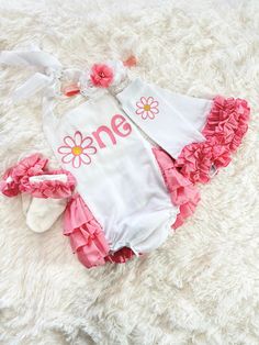 This adorable romper is perfect for your princess' first birthday outfit. It makes a great photo prop for birthday invitations or to pictures just to remember this special day!! The romper has straps that untie so you can lower or raise the outfit for a better fit. The back of the romper has layers of ruffle and the top of the ruffles is embellished with  a gold bow. If you would like a different color bow, please message me with the color that you would like.  The headband is made to fit the size that is chosen for the romper. If you would like the headband to be a different size please just leave a message on your order with the size that you would like me to make for you.   Leg warmers are super soft and stretchy and fit ages 3-36 months   Ruffle socks are stretchy and fit up to 24 mont Cute White First Birthday Sets, Pink First Birthday Sets For Spring, Pink Sets For First Birthday In Spring, Cute Pink Bubble Romper For Birthday, Personalized Cute Sets For First Birthday, White Ruffled Birthday Set, White Ruffled Sets For Birthday, White Ruffled Set For Birthday, Cute Fitted Bubble Romper For Birthday