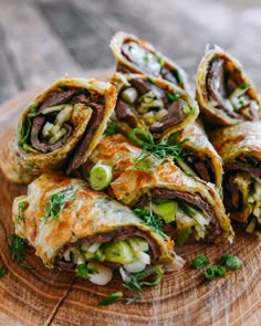 some food that is sitting on top of a wooden board and ready to be eaten