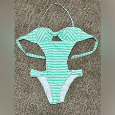 Bikini Lab One Piece Cutout Swimsuit Color: Mint Green/White Stripe Size: M Condition: Nwot, Tried It On With Undies But Never Worn. Ties In Back, Neck Strap Removable, Sparkly And Super Cute!! Green Cutout Swimwear For The Beach, White Backless Tankini For Poolside, White Backless Tankini For Swimming, White One-piece Tankini With Lined Body, White Backless Tankini For Summer, Summer White Backless Tankini, White Backless Summer Tankini, White Halter Neck One-piece Swimsuit, White Cutout Swimwear For Swimming