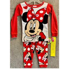 Get Your Little Girl Ready For Bed With This Adorable 2-Piece Pajama Set Featuring Her Favorite Disney Character, Minnie Mouse. The Set Includes A Long Sleeve Top And Matching Pants, Both Adorned With Colorful Minnie Mouse Graphics. The Pajamas Are Made For Girls In Size 18 Months And Are Perfect For Keeping Your Little One Cozy And Comfortable Throughout The Night. These Pajamas Are A Great Addition To Your Little One's Sleepwear Collection And Are Sure To Bring A Smile To Their Face. The Set I Red Cartoon Print Cotton Sleepwear, Red Cotton Sleepwear With Cartoon Print, Red Cartoon Print Sleepwear For Sleepover, Cute Red Bedtime Set, Cute Red Bedtime Sets, Cute Red Pajama Party Sets, Red Cartoon Print Sets For Playtime, Disney Long Sleeve Sets With Character Print, Red Character Print Sleepwear For Sleepover