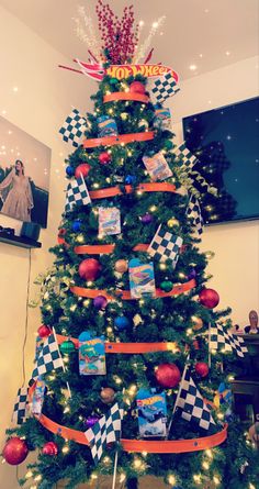 a christmas tree decorated with checkered ribbon