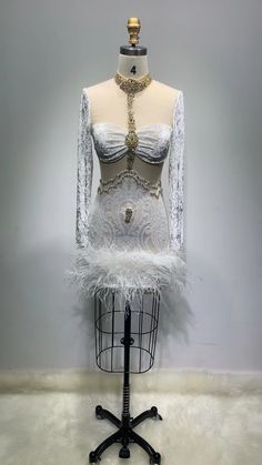 a mannequin with white feathers on it