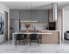 a modern kitchen with marble counter tops and wooden cabinets, along with two black chairs