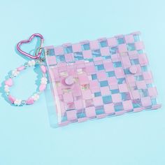 Store your loose change and other small essentials inside this flat pouch! It has pink checkered patterns and a cute print of My Melody harvesting giant flowers. This handy transparent pouch also comes with a special bracelet-like charm made from pastel beads. Features top and bottom snap button closures Comes with a heart-shaped carabiner Pink Square Pouch For Daily Use, Trendy Pink Pouch For Everyday Use, Trendy Pink Everyday Pouch, Trendy Pink Pouch For Personal Use, Handmade Pink Rectangular Pencil Case, Trendy Pink Pencil Case For Everyday, Trendy Pink Pouch For Gift, Trendy Pink Pouch As Gift, Trendy Pink Rectangular Pencil Case