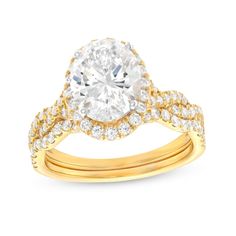 Start the next exciting chapter in your love story with the beautiful twist design of this oval lab-created diamond frame bridal set in 14K gold. Fashioned in 14K gold The engagement ring showcases a 2 ct. certified oval-shaped lab-created diamond boasting a color rank of I and clarity of Si2. Lab-created diamonds sparkle along the halo frame and the twist ribbons of the shank. A contoured wedding band adds a final layer of shimmering lab-created diamonds to the look. Includes certification card Oval Brilliant Cut Bridal Sets For Anniversary, Oval Bridal Sets With Center Stone For Anniversaries, Oval Diamond Bridal Sets With Center Stone, Oval Halo Yellow Gold Wedding Ring, Classic Oval Bridal Sets For Formal Occasions, Oval Cubic Zirconia Bridal Sets For Wedding, Oval Diamond Bridal Sets For Anniversary, Cubic Zirconia Bridal Sets For Wedding, Oval Diamond Bridal Sets For Formal Occasions