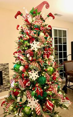 a decorated christmas tree with candy canes and ornaments