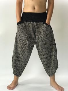 "Samurai Pants (Unisex) Elastic Waist Handmade Pants with a very unique pattern, Unisex pants so Comfortable to Wear & Stylish. Men Japanese Samurai Style Japanese Casual, Hakama cotton Pants, Samurai Pants - elastic waistband Fits all! Unisex pants, These beautiful casual pants is unique & comfortable to wear samurai pants, ninja pants, harem pants, Cotton Men pants, Relaxing and simply lifestyle clothing it is easy to wear and great for many occasions. One size fits most. These pants a Black Stretch Bohemian Harem Pants, Stretch Black Harem Pants For Festivals, Black Harem Pants With Pockets For Festival, Black Harem Pants With Elastic Waistband For Festivals, Black Hippie Harem Bottoms, Black Bohemian Yoga Pants For Festivals, Bohemian Black Yoga Pants For Festivals, Black Harem Pants For Festival, Traditional Black Harem Pants With Elastic Waistband