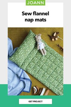 a stuffed animal sitting on top of a green mat next to shoes and blankets with the words sew flannel nap mats