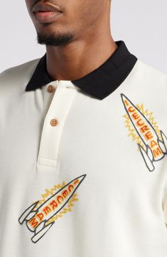 Logo-emblazoned rockets fire in colorful embroidery all over a polo made for exploring the universe in the comfort of soft, breathable cotton. Button half placket Spread collar Short sleeves 100% cotton Hand wash, line dry Imported Black Owned/Founded White Embroidered Shirt, Embroidered Polo Shirts, Polo Logo, Colorful Embroidery, Half Sleeve Shirts, Polo Blue, Mens Wear, Cotton Polo Shirt, Cotton Polo