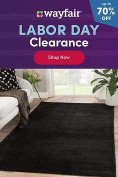 a black rug with the words labor day clearance up to 70 % off