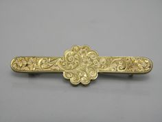 Gorgeous 9ct Yellow Gold 375 Floral Brooch Pin.  -A typically vintage looking brooch, very good vintage condition.   Crafted from solid 9ct yellow gold 375. -A beautiful vintage brooch, delicately carved with floral patterns across the whole face of the brooch,   securely fastens with a metal pin & C clasp. -Brooch length approx 44.5mm -Brooch height approx 13.5mm -Weighs just over 5grams. -Stunning design really eye catching.  Not hallmarked but has been checked & tested.  Very good vintage condition  Even though my jewellery is vintage I polish it to be worn straight away. -POSTAGE IS FREE within UK.  This includes all packaging and postage costs including a nice gift bag.  Overseas postage I now have to charge for due to the problems Royal Mail have faced. Antique Yellow Gold Wedding Brooches, Antique Hallmarked Brooches For Ceremonial Occasions, Antique Yellow Gold Brooches With Intricate Design, Ornate Engraved Yellow Gold Brooches, Antique Hallmarked Yellow Gold Brooch, Antique Hallmarked Yellow Gold Brooches, Antique Yellow Gold Hallmarked Brooches, Antique Yellow Gold Filigree Brooches, Victorian Gold Brooches For Ceremonial Occasions