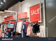 a clothing store display with clothes for sale