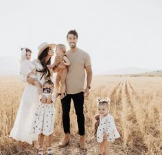 a family standing in a wheat field