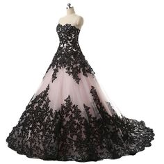 a black and pink ball gown on a mannequin