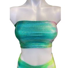 FESTIE BESTIE SEAFOAM HOLOGRAPHIC  Includes a tube top. HOLO is a 4-way stretch polyester spandex blend, which fits tight and stretches to include a variety of body types. Fabric pattern can vary from item to item. Our products are made to order, please review our store policies before purchasing because refunds are not available after purchase. International shipping available. Green Seamless Stretch Tube Top, Green Fitted Bandeau Tank Top, Fitted Green Bandeau Tank Top, Green Stretch Bandeau Tube Top, Green Stretch Bandeau Crop Top, Fitted Seamless Green Tube Top, Fitted Green Seamless Crop Top, Womens Halter Tops, Festival Tops