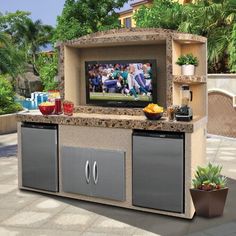 an outdoor grill with a television on it