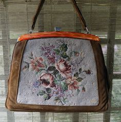 Beautiful petite point hand bag from 60's in good vintage condition 7/10 (in a few places the thread on the tapestry is missing) + color: brown leather + pattern: floral/tapestry + orange mother of pearl detail + metal buckle + light green lining dimensions 31 x 24cm handle 20 x 13cm Formal Vintage Tapestry Bag, Vintage Beige Satchel, Vintage Formal Tapestry Bag, Vintage Tapestry Bag For Formal Occasions, Vintage Handmade Tapestry Bag, Vintage Tapestry Handmade Bags, Vintage Beige Tapestry Bag, Antique Tapestry Bags For Everyday, Vintage Beige Satchel With Handles