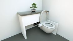 a white toilet sitting next to a table with a potted plant on top of it