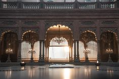 an ornate building with chandeliers and windows