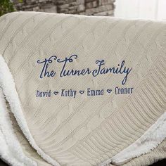 a white blanket with blue lettering on it that says, the tunnel family david and kathy emo comfort