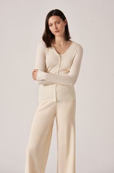 Our classic 2x2 rib long sleeve v-neck button cardigan. Perfect for any occasion. Beautiful cashmere silk blend. TCOYG88 - 70% Cashmere, 30% Silk Cream Cashmere V-neck Cardigan, Classic V-neck Fine Knit Cardigan, Elegant Cashmere V-neck Cardigan, Elegant V-neck Sweater For Loungewear, Elegant V-neck Fine Knit Cardigan, Elegant V-neck Cashmere Cardigan, Classic Cream V-neck Cardigan, Elegant Cream V-neck Sweater For Spring, Elegant Cream V-neck Cardigan