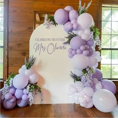 a table with balloons and flowers on it