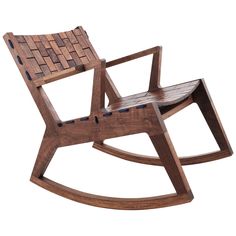 a wooden rocking chair with woven seat cushions